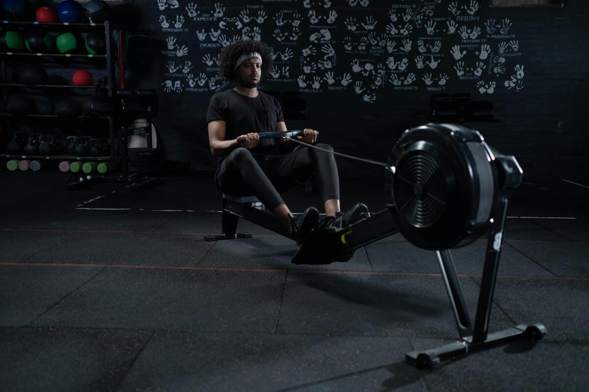 Man using rowing machine.