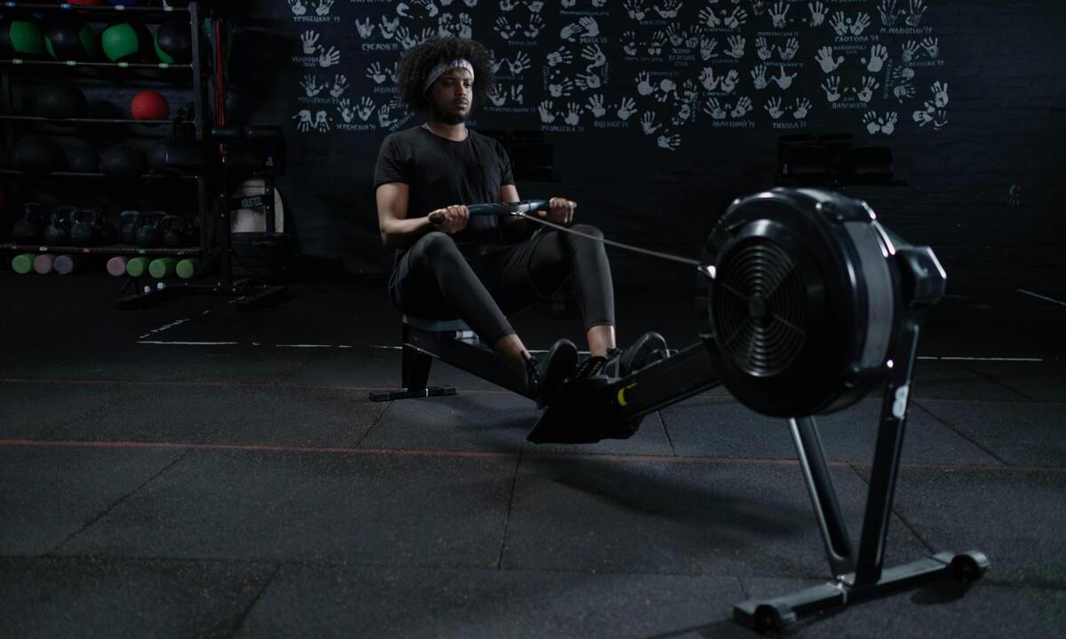 Man using rowing machine.