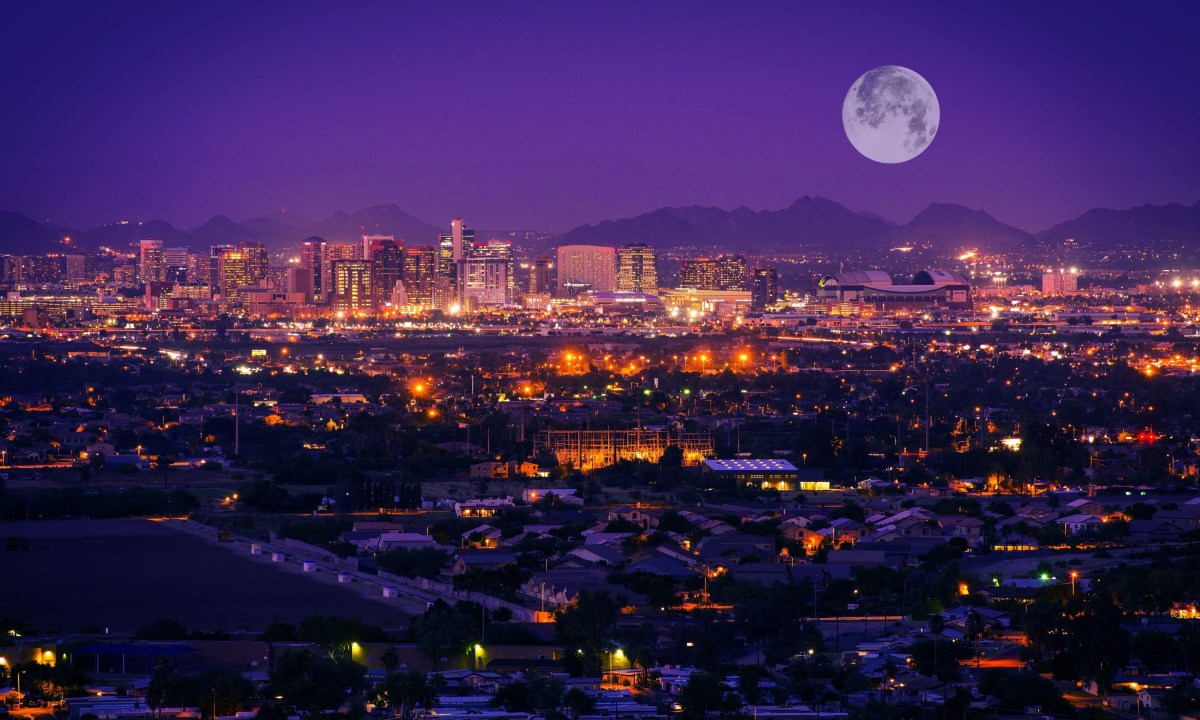 Phoenix Arizona skyline at night. full moon over Phoenix, Arizona