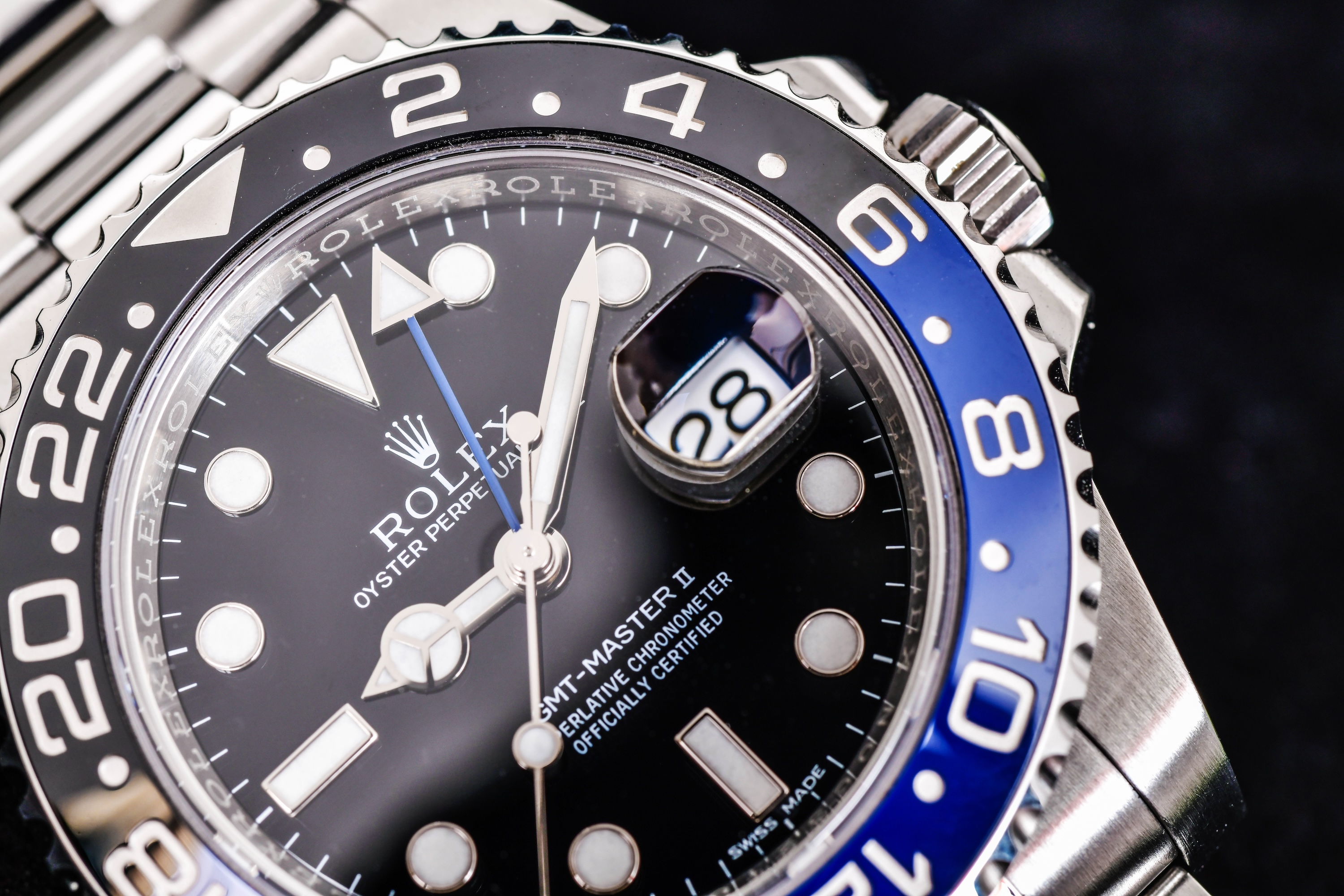 Close up Rolex GMT-Master II "Batman"40mm with blue-black bezel Steel Ceramic Men's Wrist watch on black background