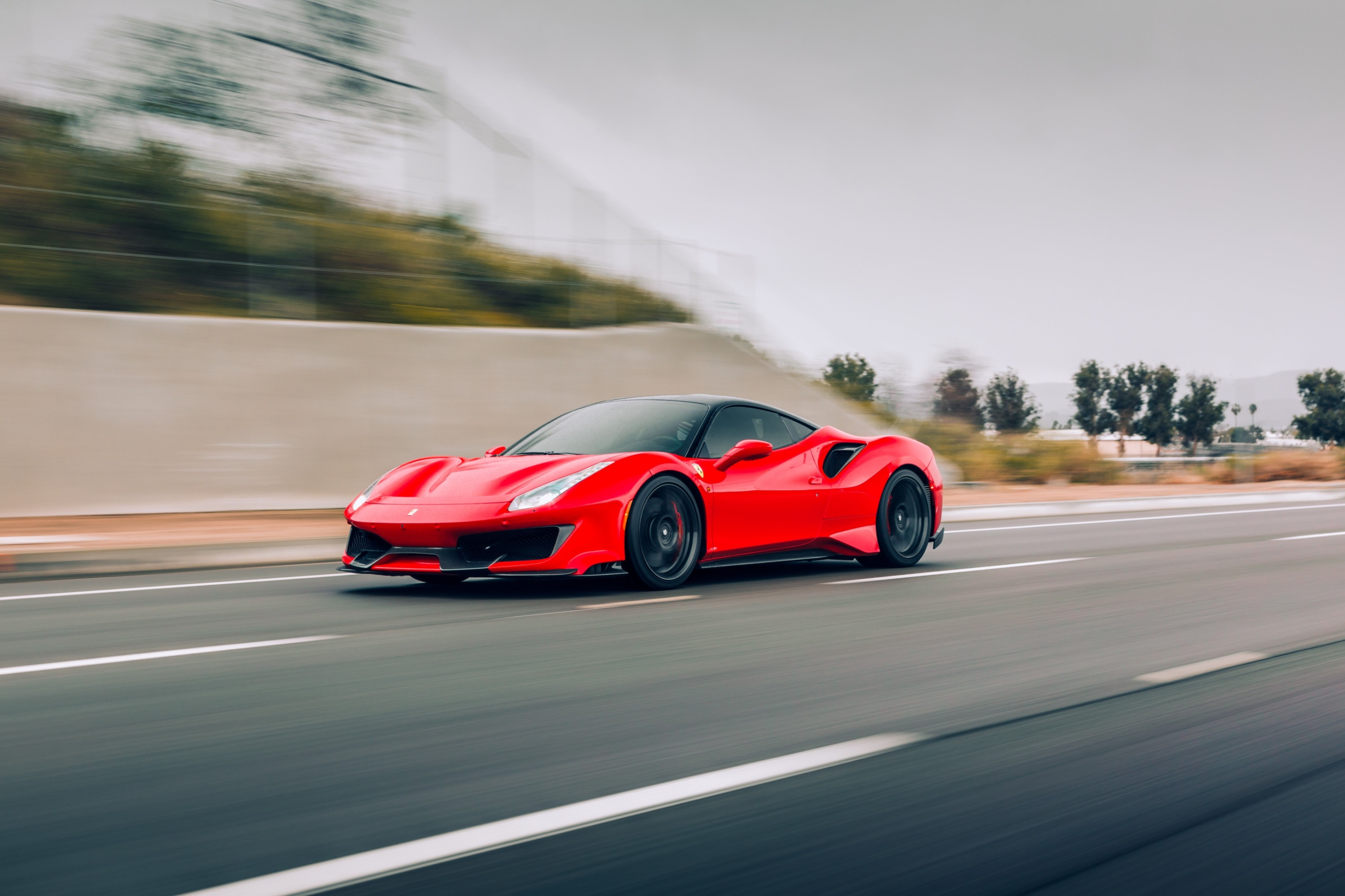  Ferrari 488 Pista driving on the highway by itself