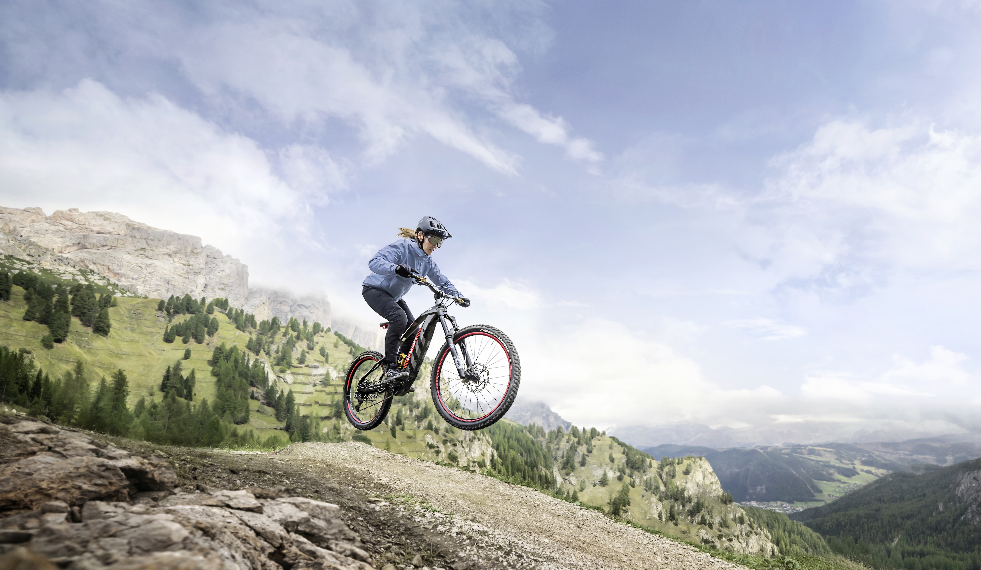A mountain biker jumping on the new Audi eMTB