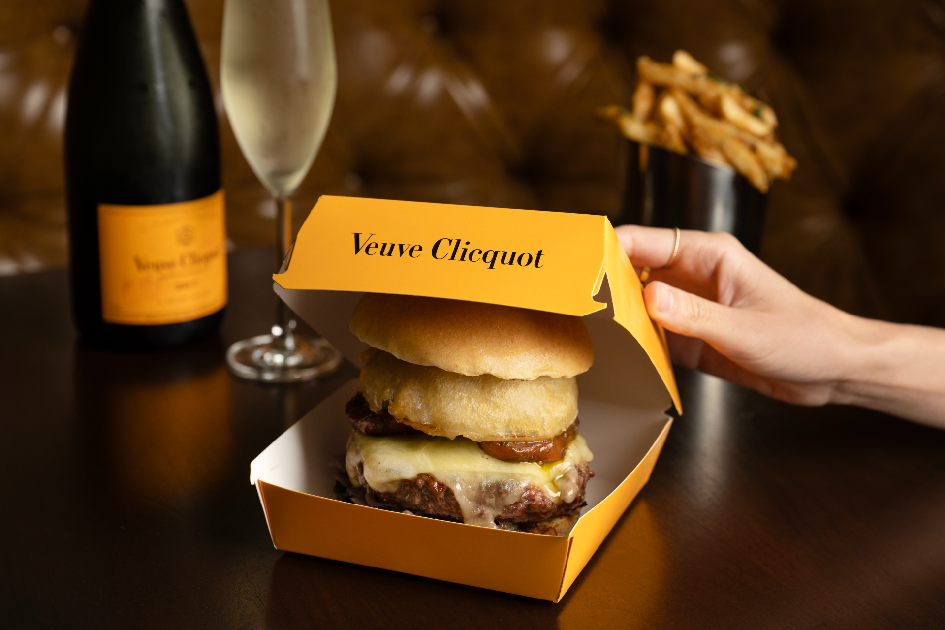 burger in yellow takeout box