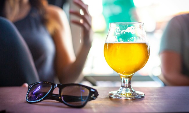 Beer next to sunglasses
