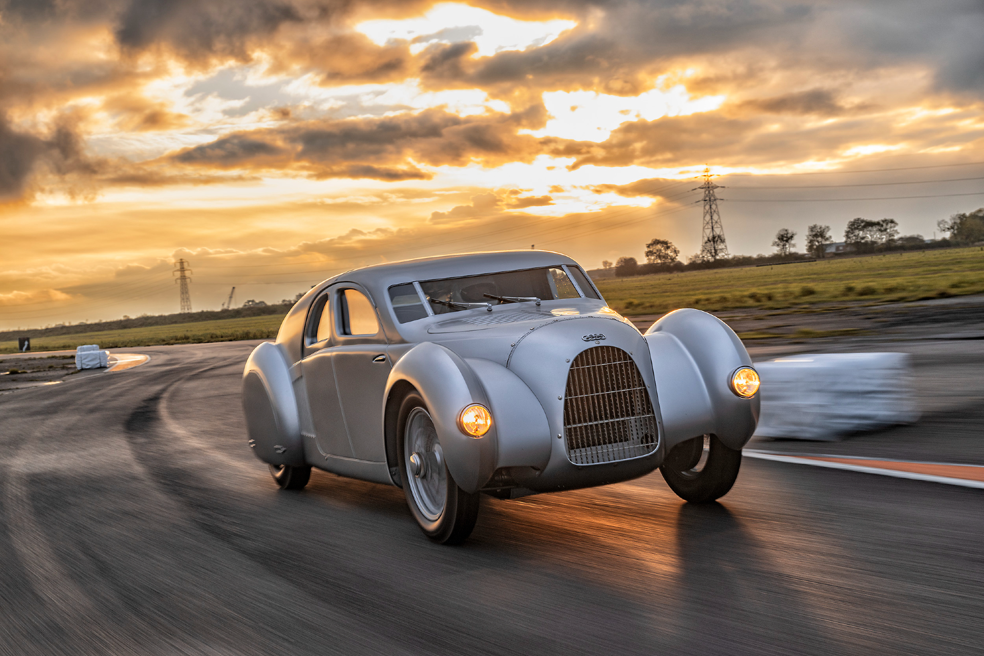 2023 Audi Schnellsportwagen image driving on a curved road.