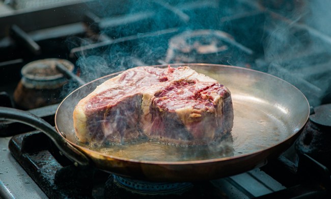 Steak frying in a pan