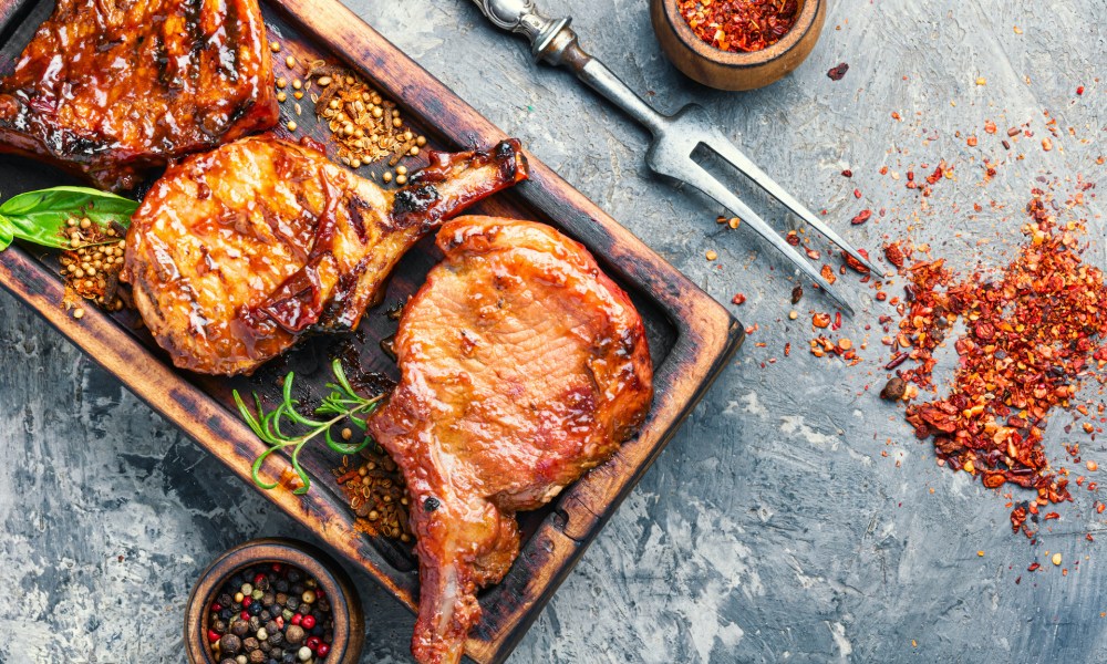 Pork chops on cutting board
