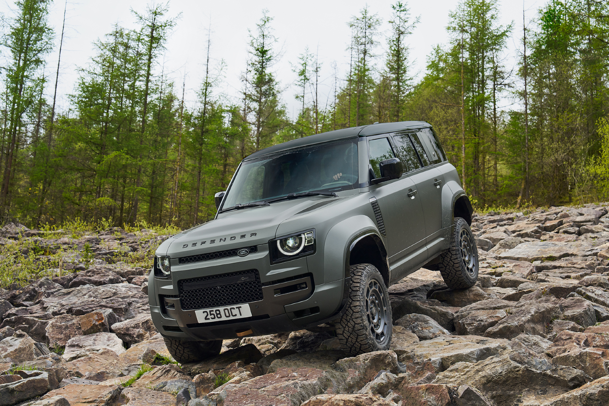 Land Rover Defender OCTA descending a rocky slope.