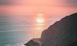 The sun setting over the ocean