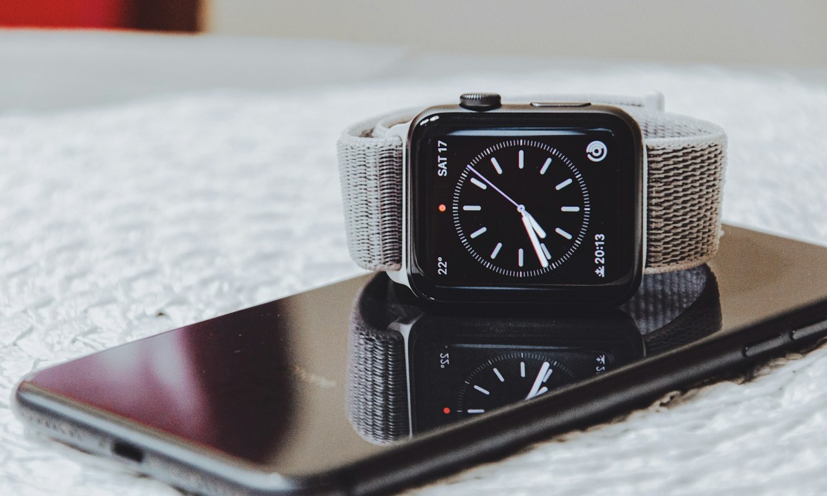 Apple Watch sitting on top of phone