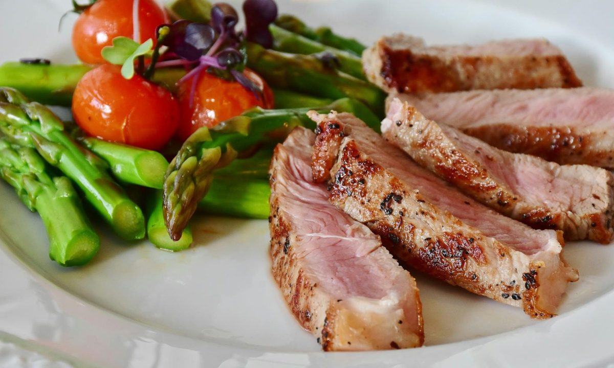 Dinner plate with cooked meat and vegetables