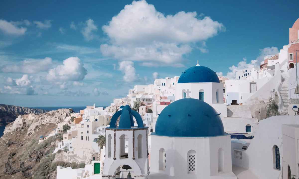 white buildings with blue domed roofs