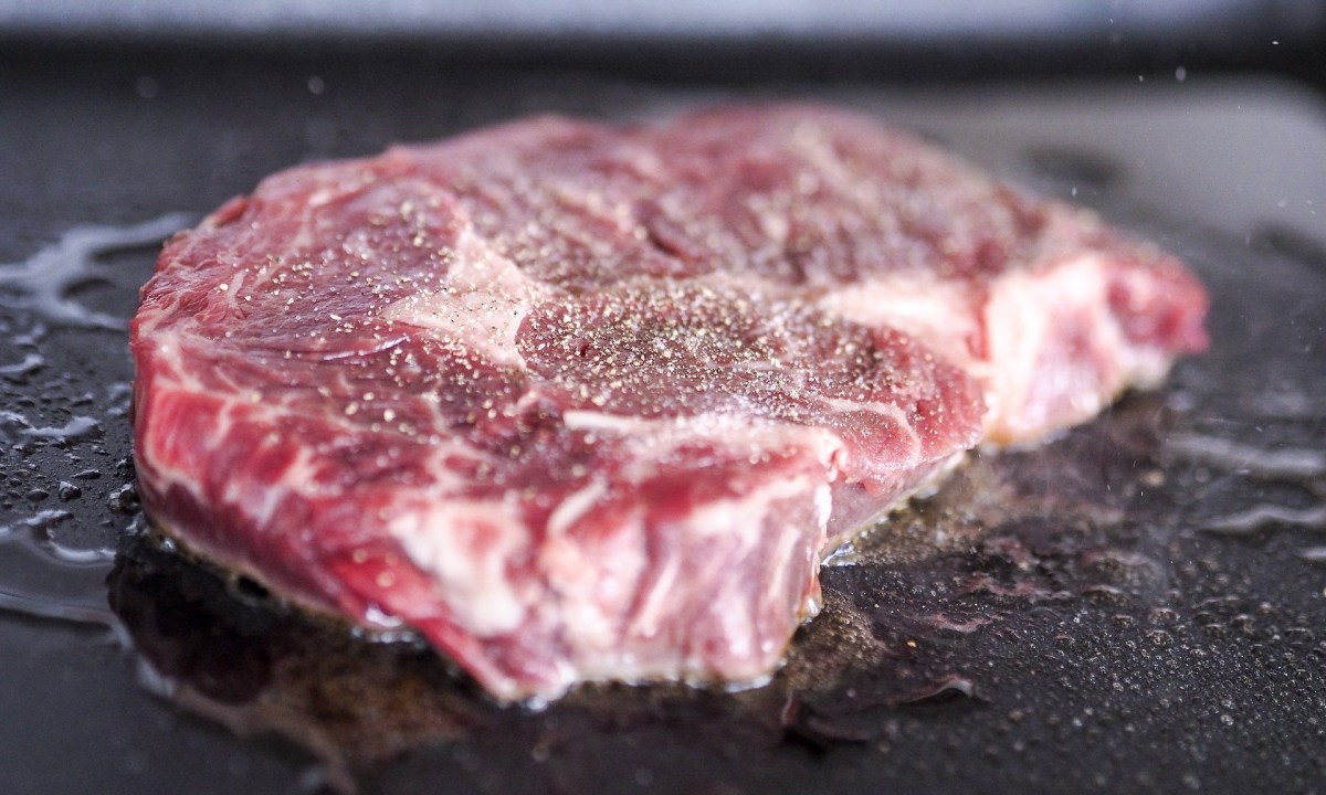 Steak cooking on flat top