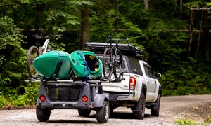 SylvanSport's 2025 Micro Adventure Series line-up mounted to a white Toyota Tacoma pickup truck