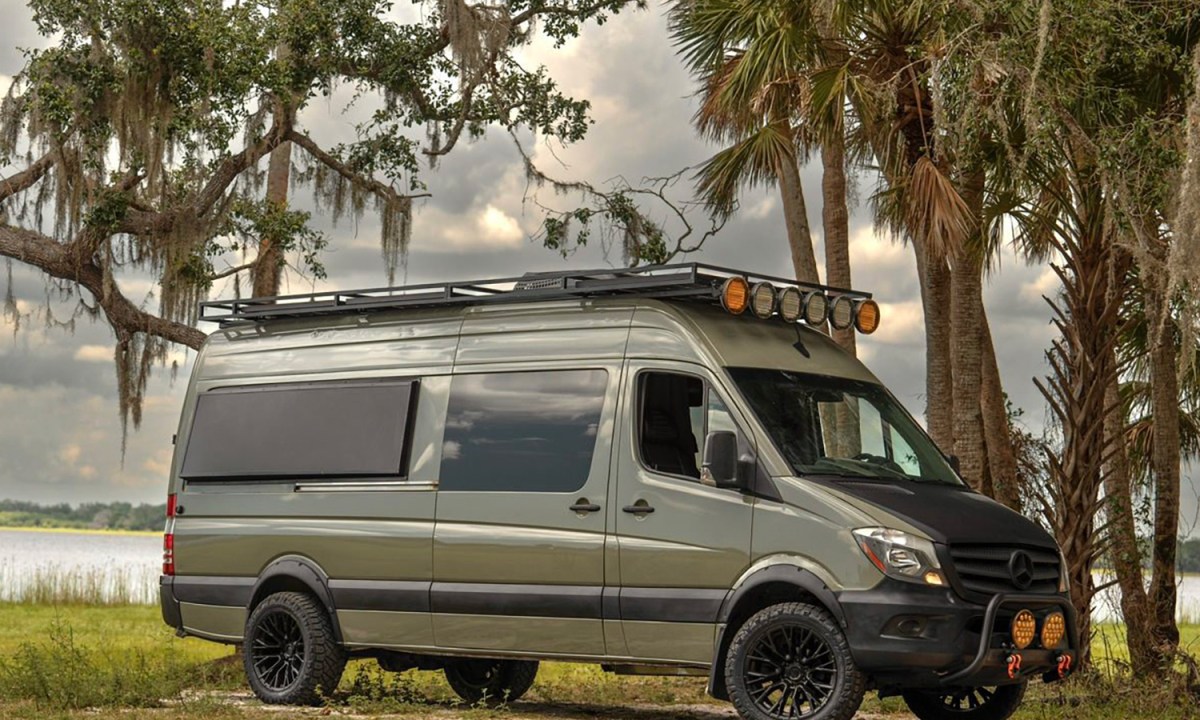War Horse All-Terrain custom camper van parked near a lake in Florida.