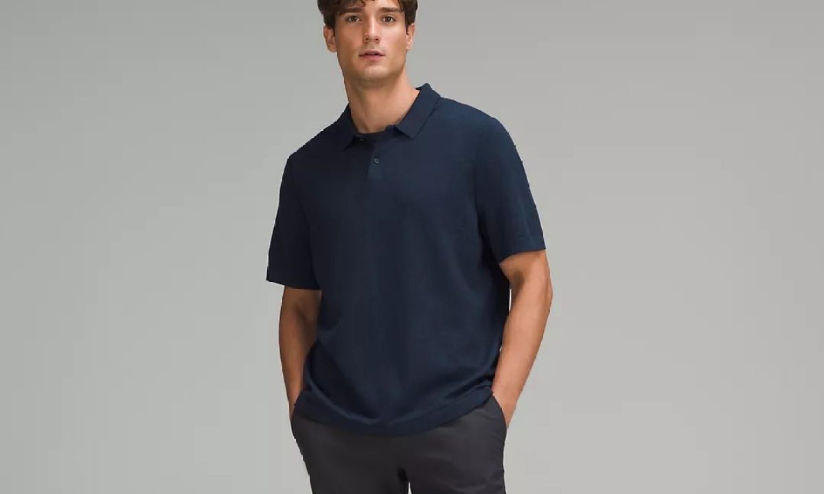 A man posing with Lululemon's New Venture Short-Sleeve Knit Polo Shirt.