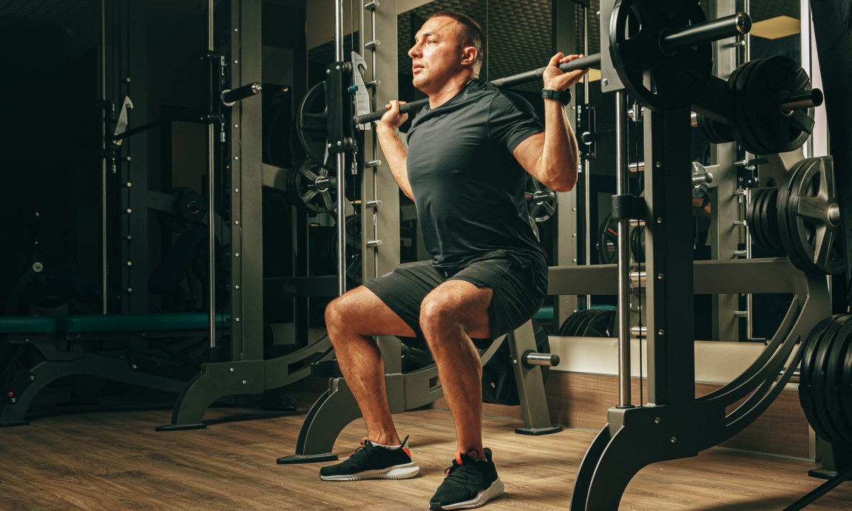 Man doing Smith machine squats
