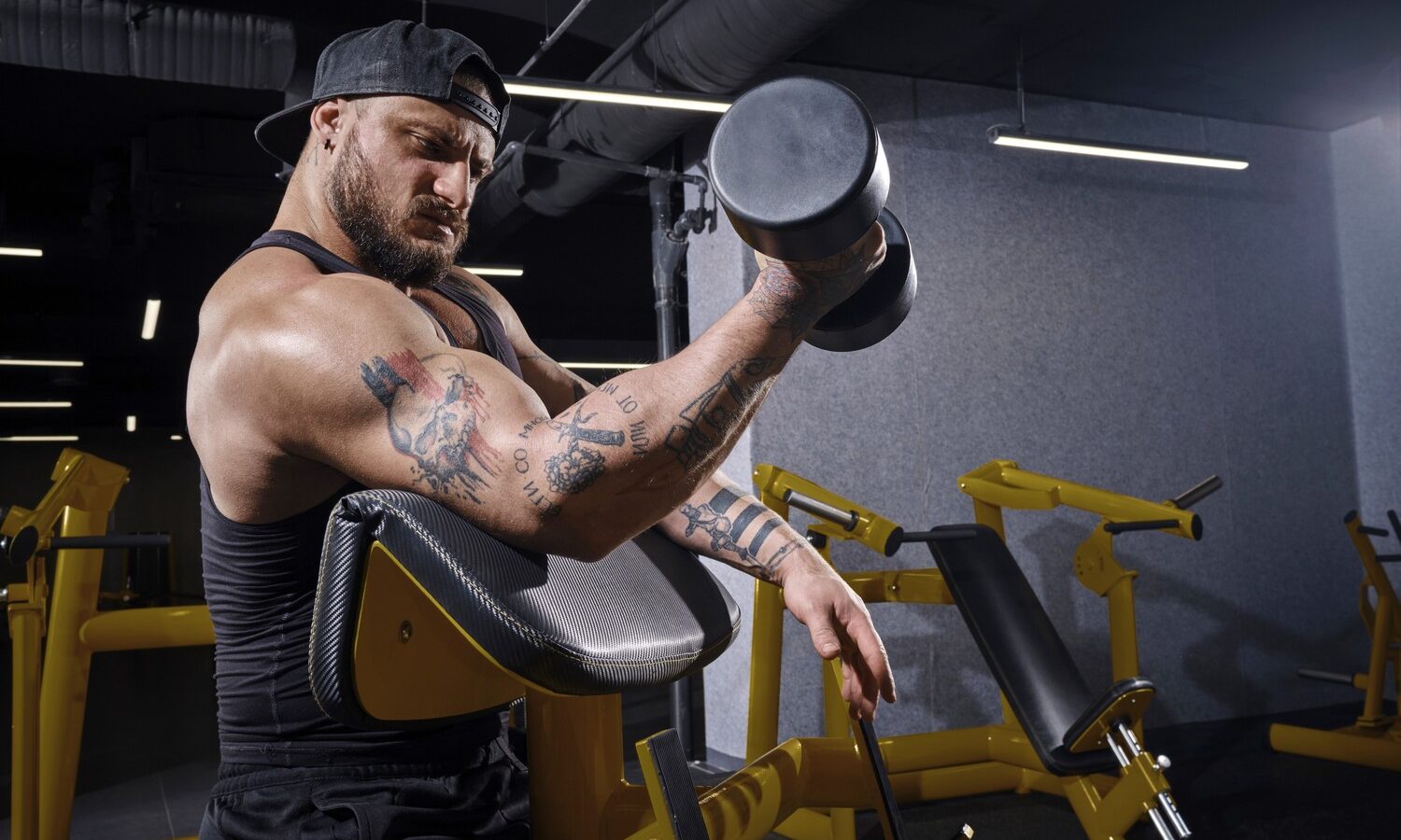Man doing preacher curls.