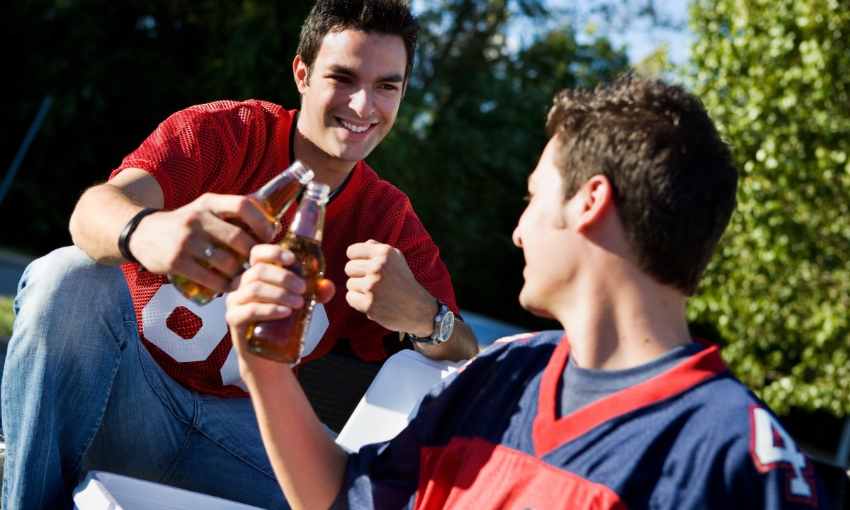 Group of friends doing football tailgating