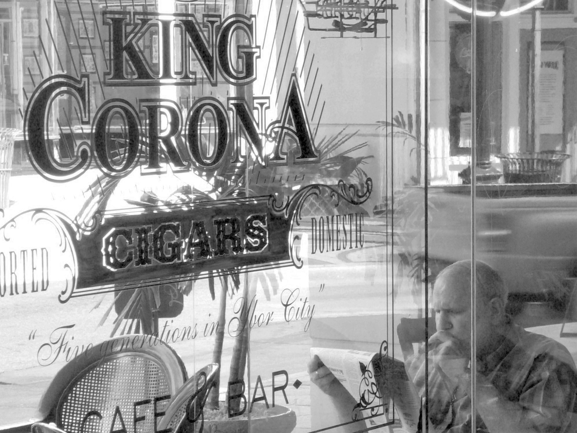 Man sitting at King Corona Cigar cafe in Ybor City, Florida.