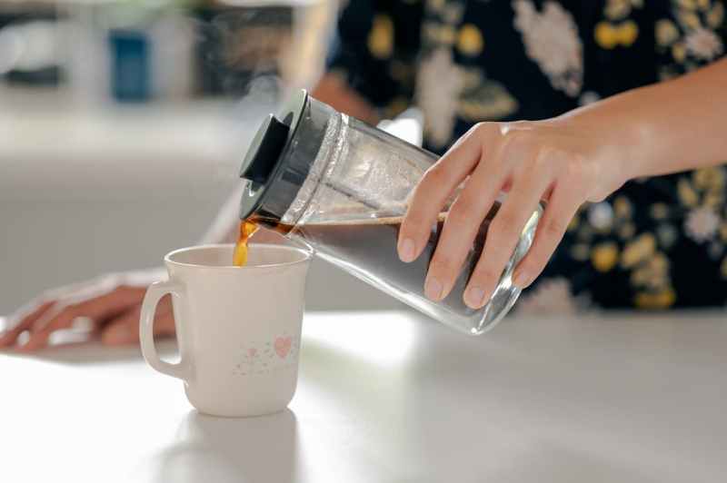 Pouring coffee from a French press