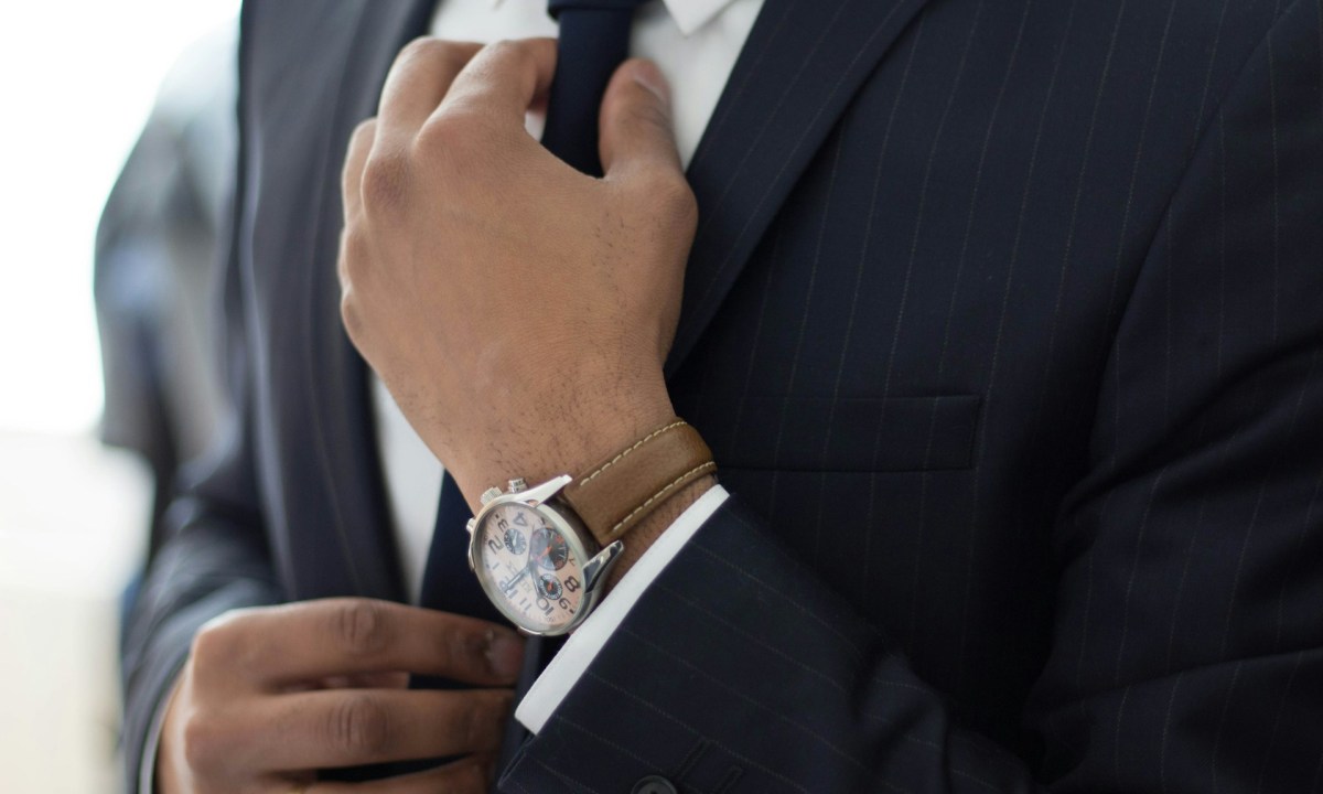 Man with watch and brown strap