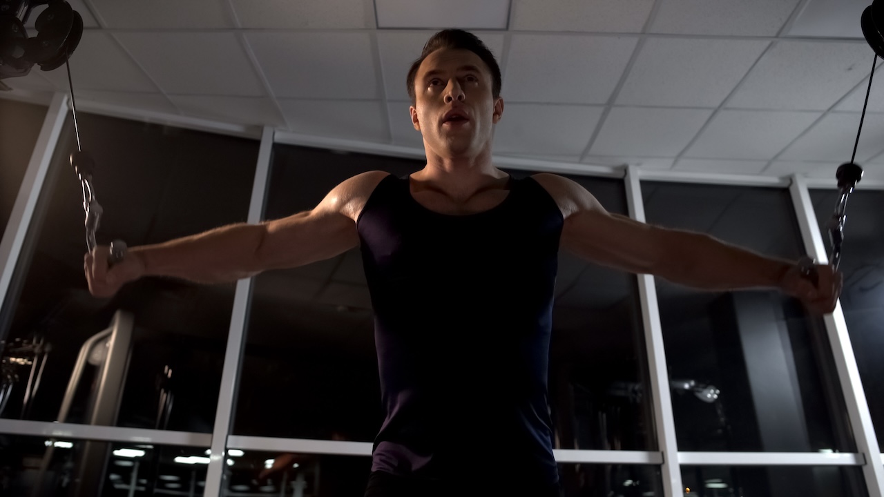 Man doing the cable fly