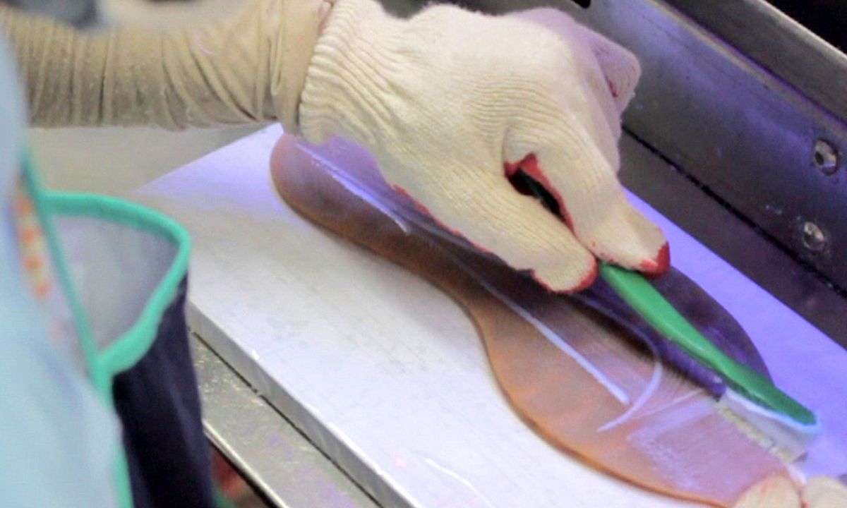 person creating shoe material