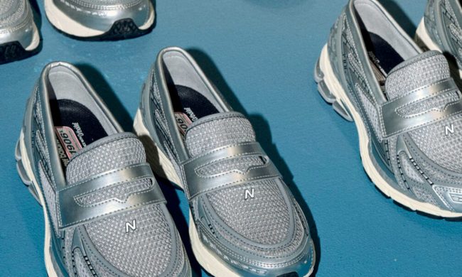 silver New Balance loafer shoes on blue background