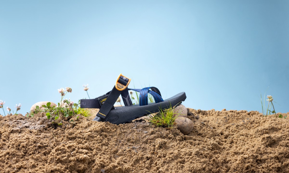 lone sandal sitting on pile of dirt