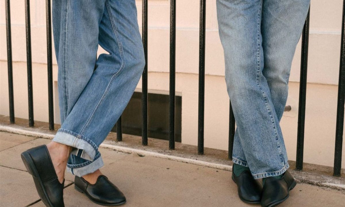 two men wearing black bolo slippers