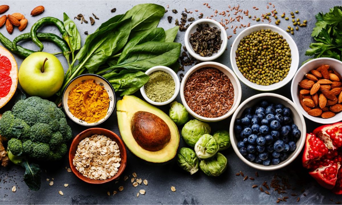 Fruits and veggies against a gray table