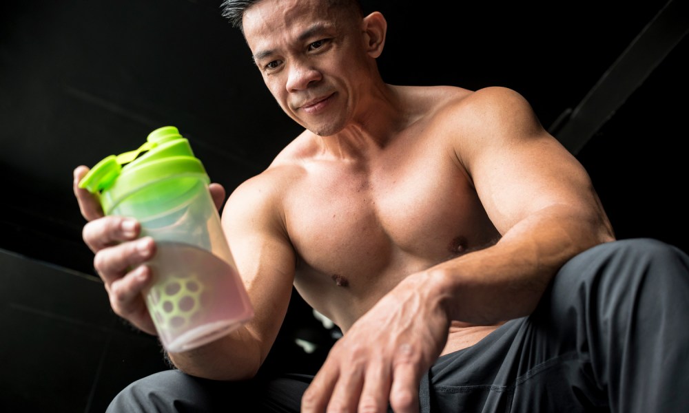 Man with pre-workout drink.