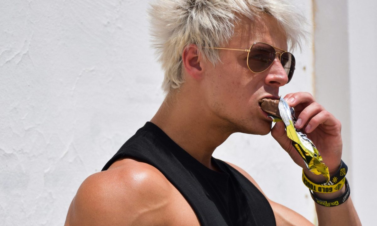 Man eating protein bar