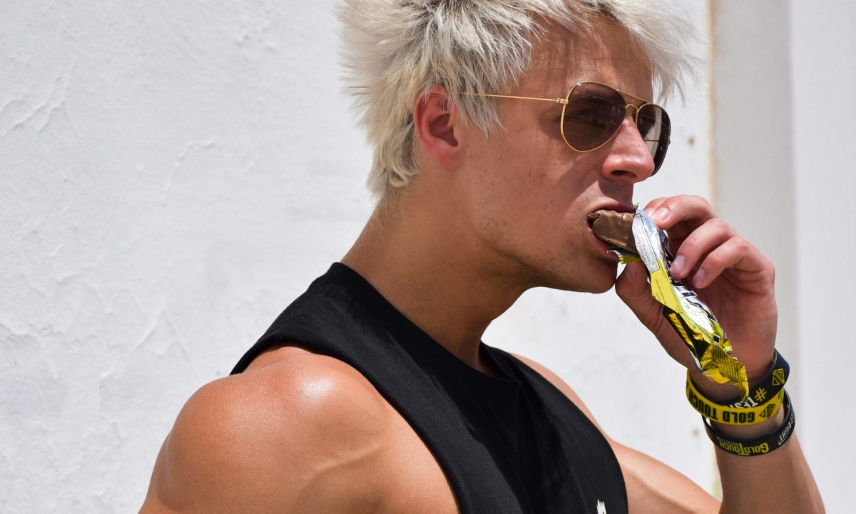 Man eating protein bar