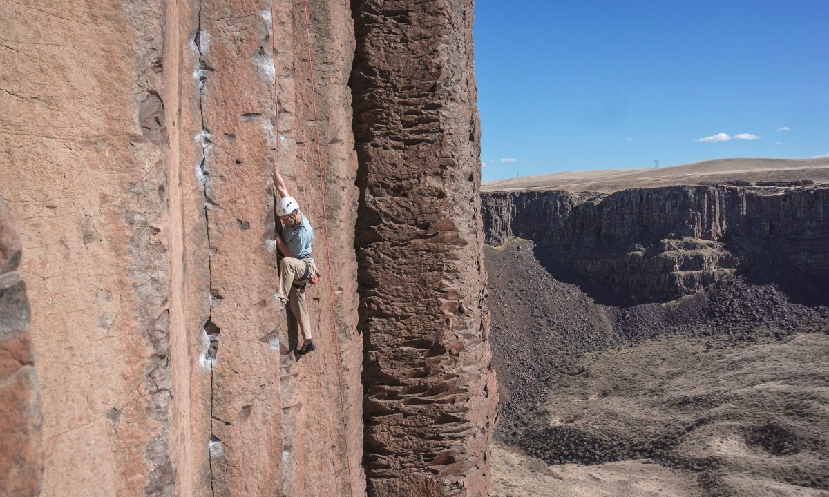 Rock climber with helmet