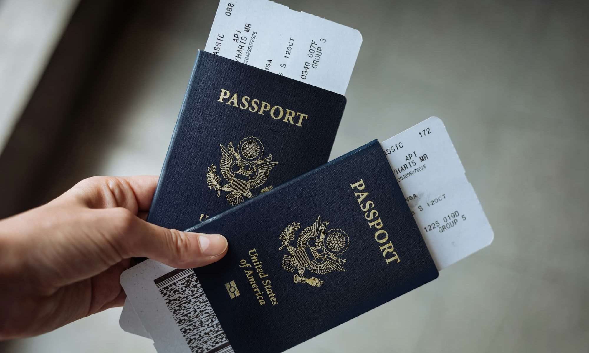 Hand holding two U.S. passports