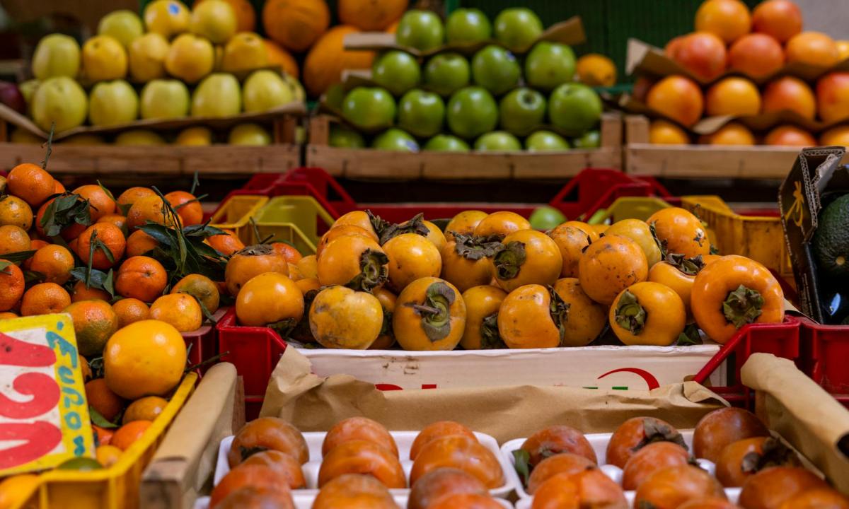 Table of fall fruit including persimmons and citrus