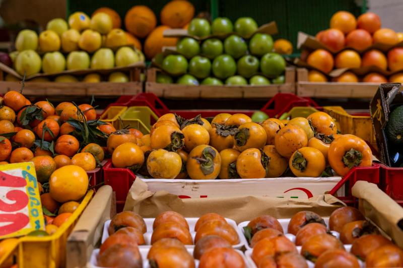 Table of fall fruit including persimmons and citrus