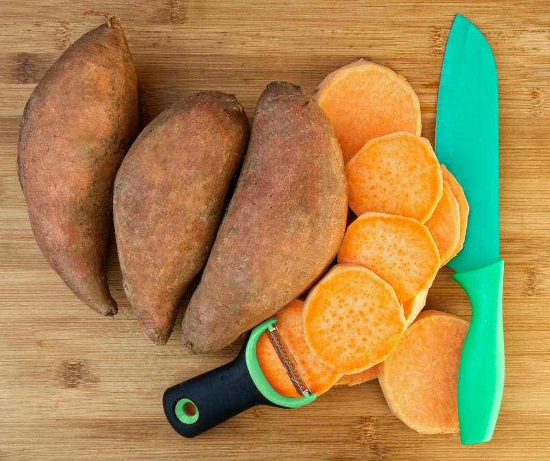 Sweet potatoes, one peeled and sliced
