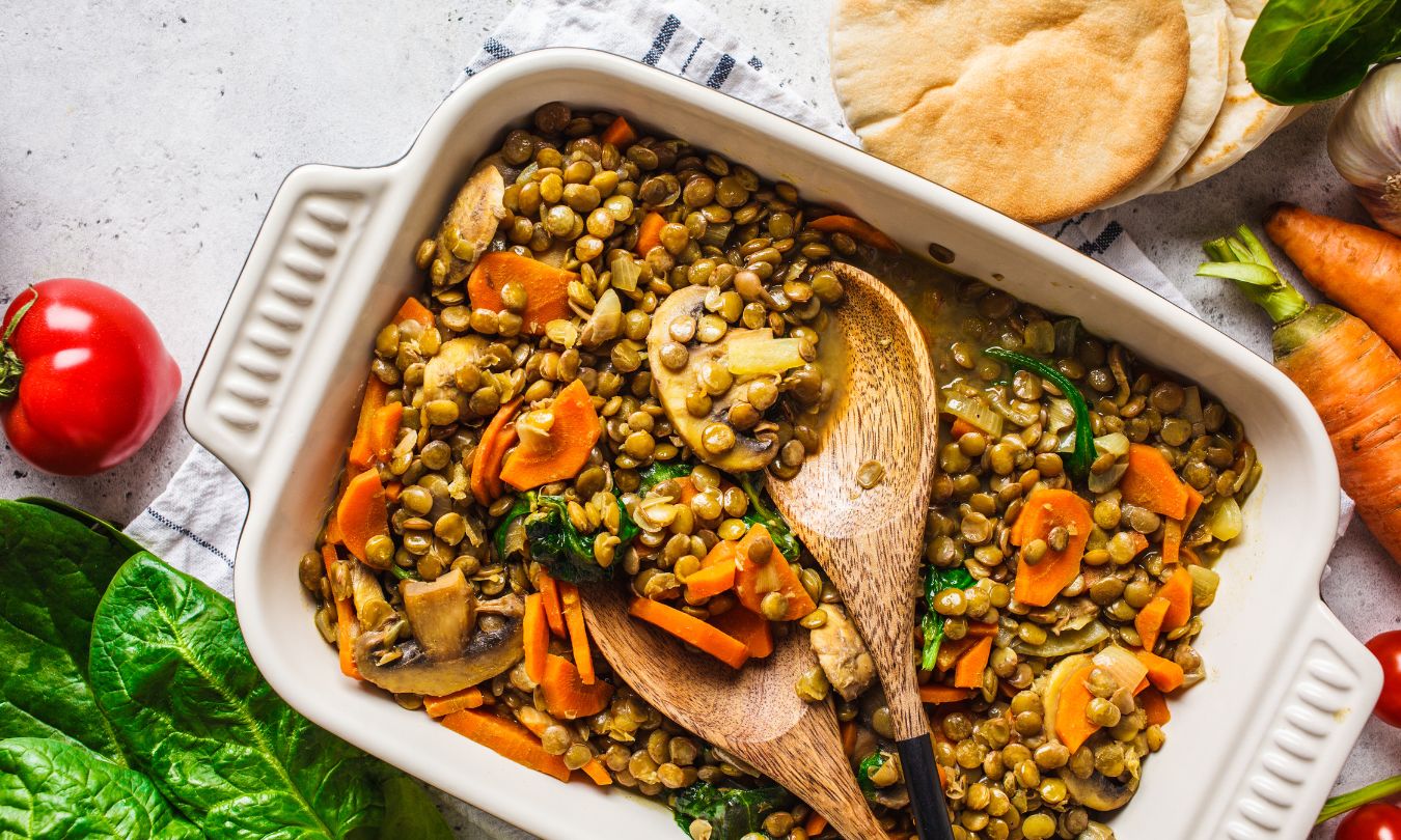 Vegan lentil curry with vegetables, top view. Healthy plant based food background