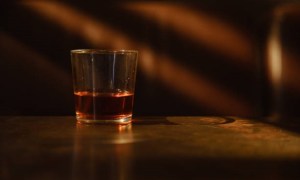 Whiskey in a glass in a dark room