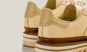 backside of the adidas superstar sneaker in tan