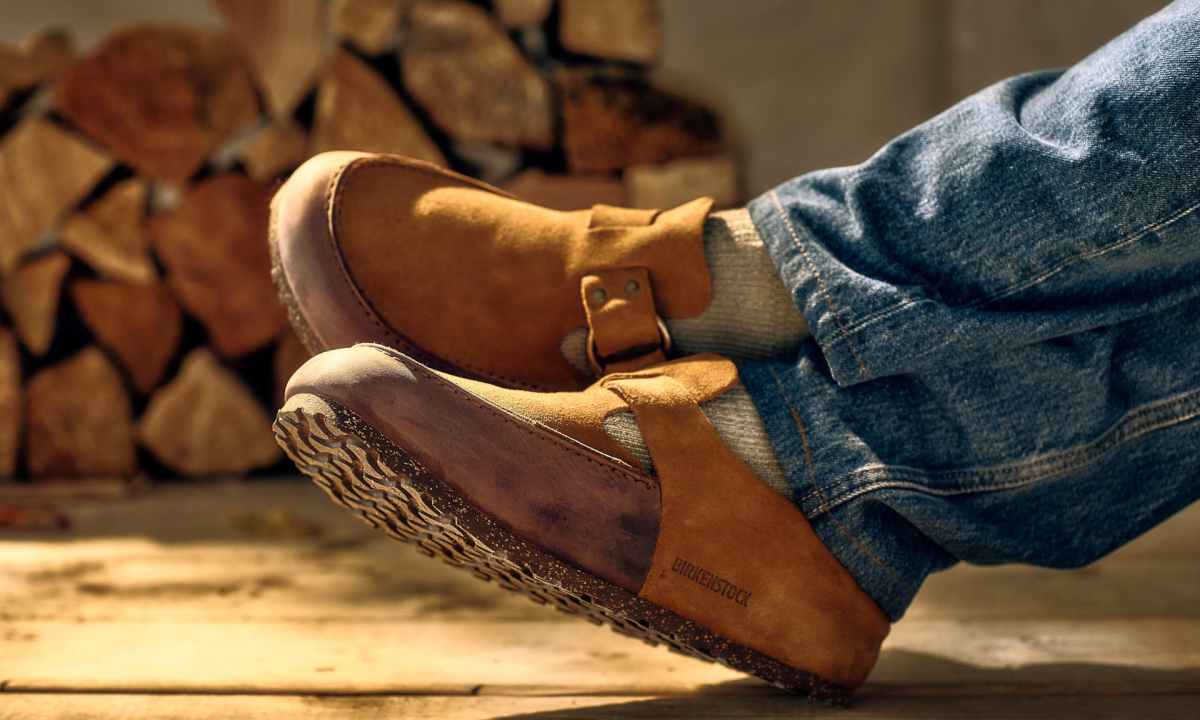 man wearing birkenstock and filson mule
