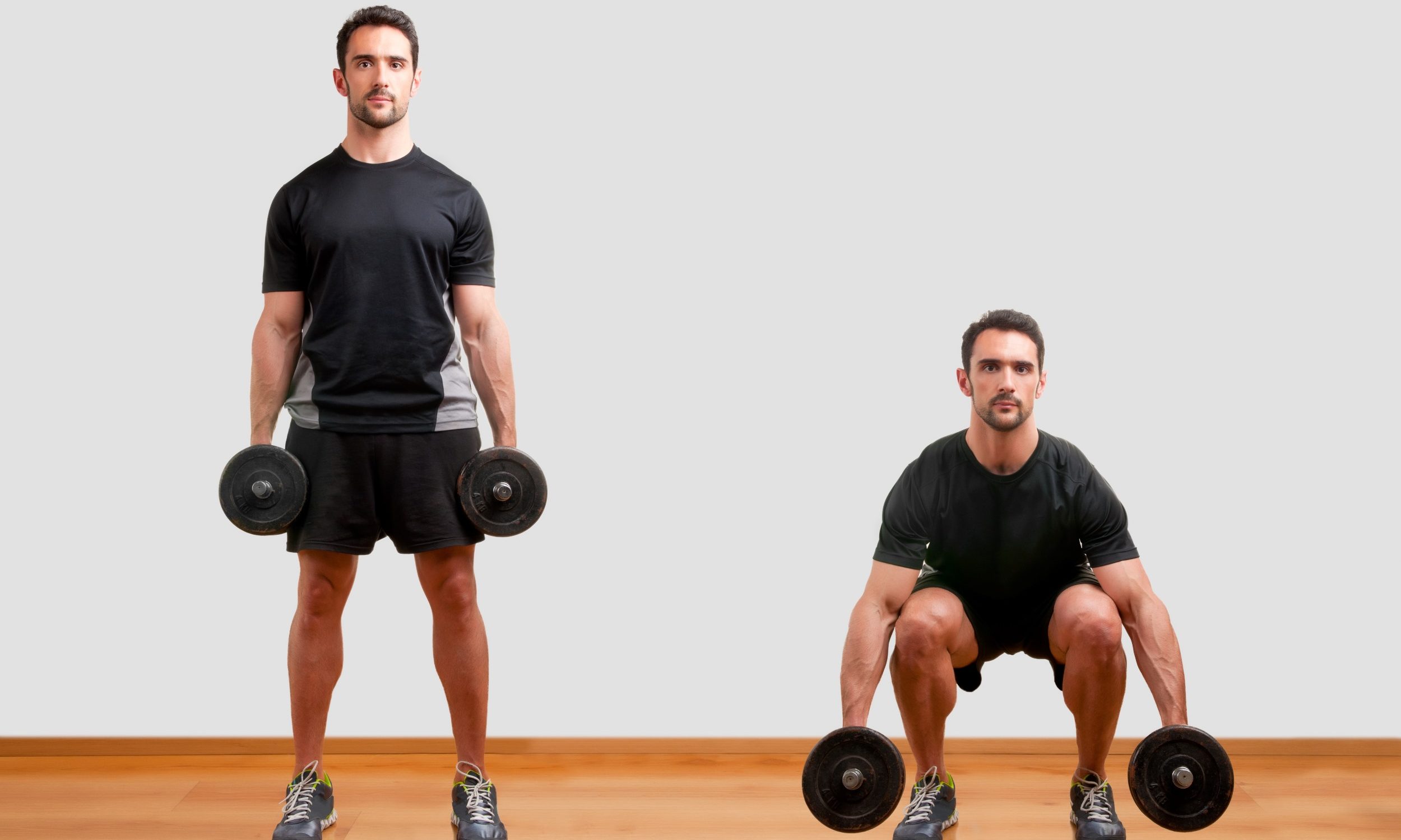 Man wearing black T-shirt doing dumbbell squat exercise on wooden floor