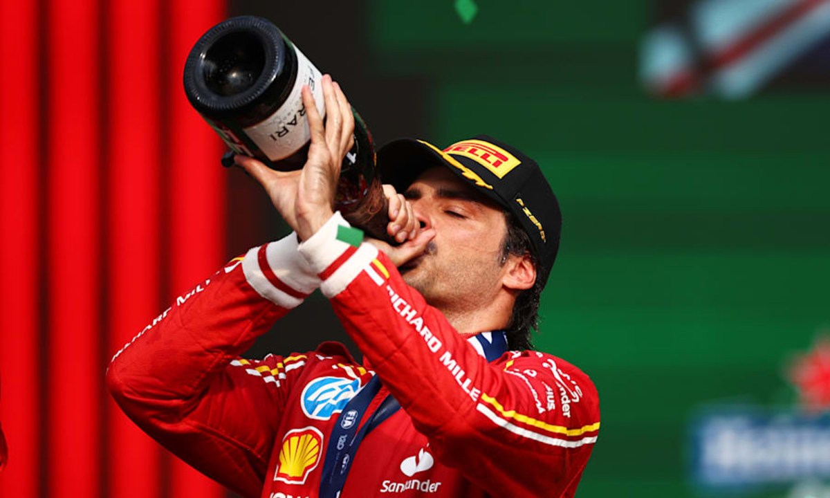 Carlos Sainz drinks from the champagne magnum after winning the 2024 Mexico City Grand Prix.