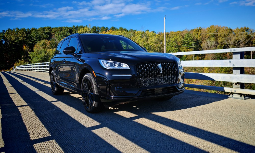 Front 3/4 view of a black 2024 Lincoln Corsair on a bridge
