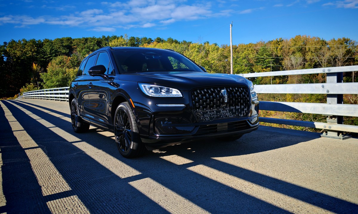 Front 3/4 view of a black 2024 Lincoln Corsair on a bridge