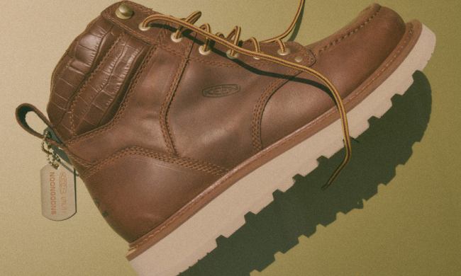 tan work boot on green background