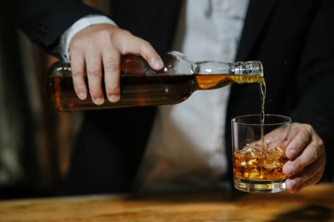 Whiskey pouring into a glass